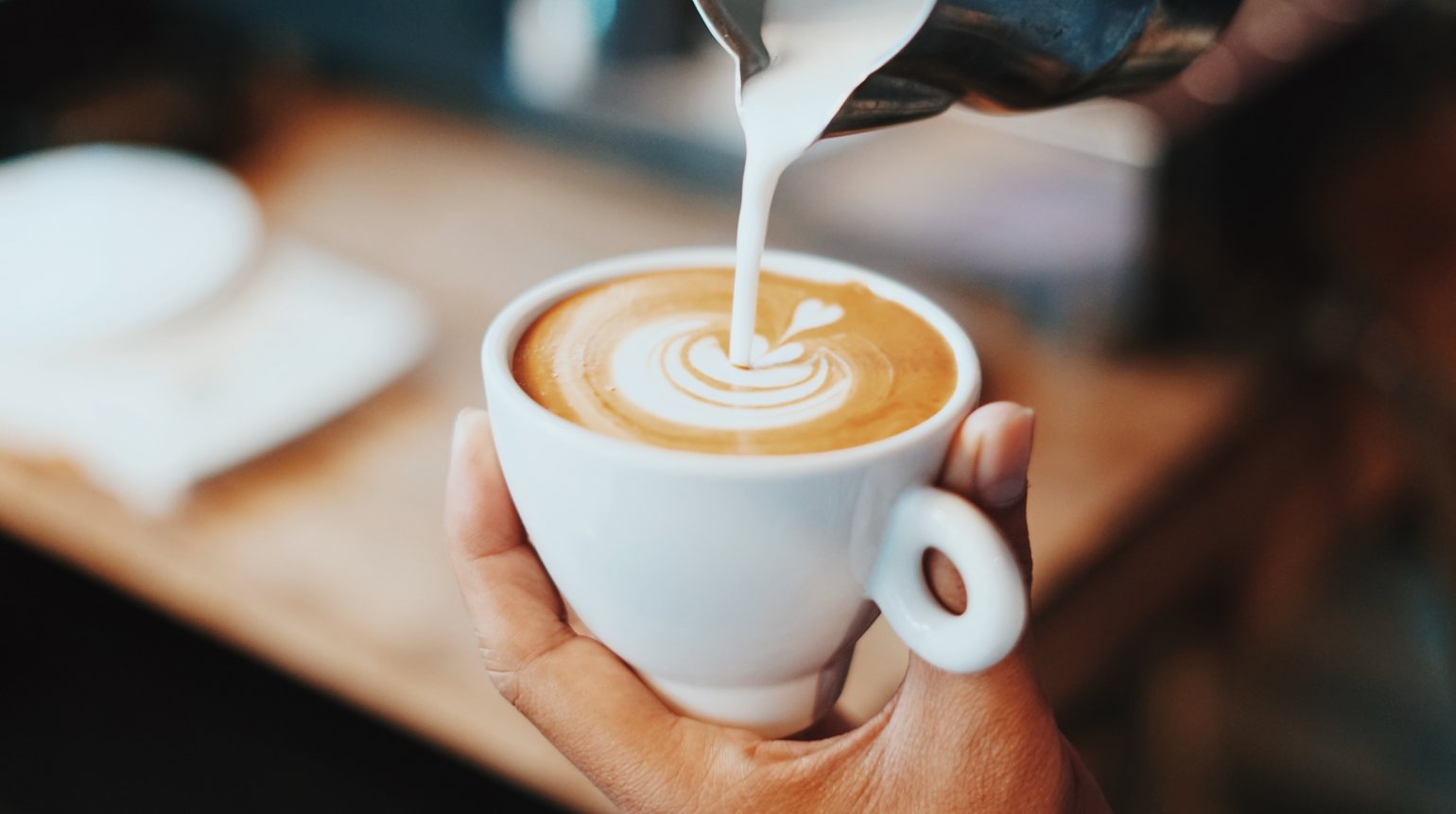 barista making delicious coffee